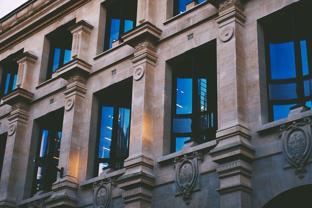 Granite facade of a historic cultural building at dusk