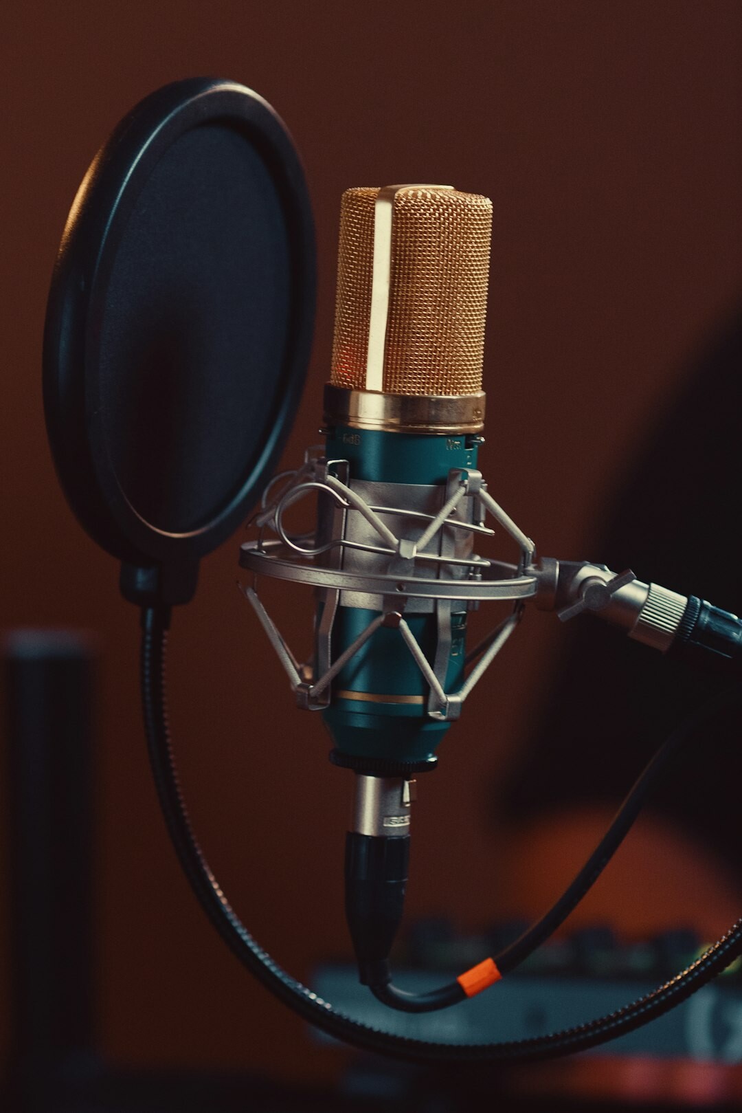 Vintage microphone on a stand in a recording studio