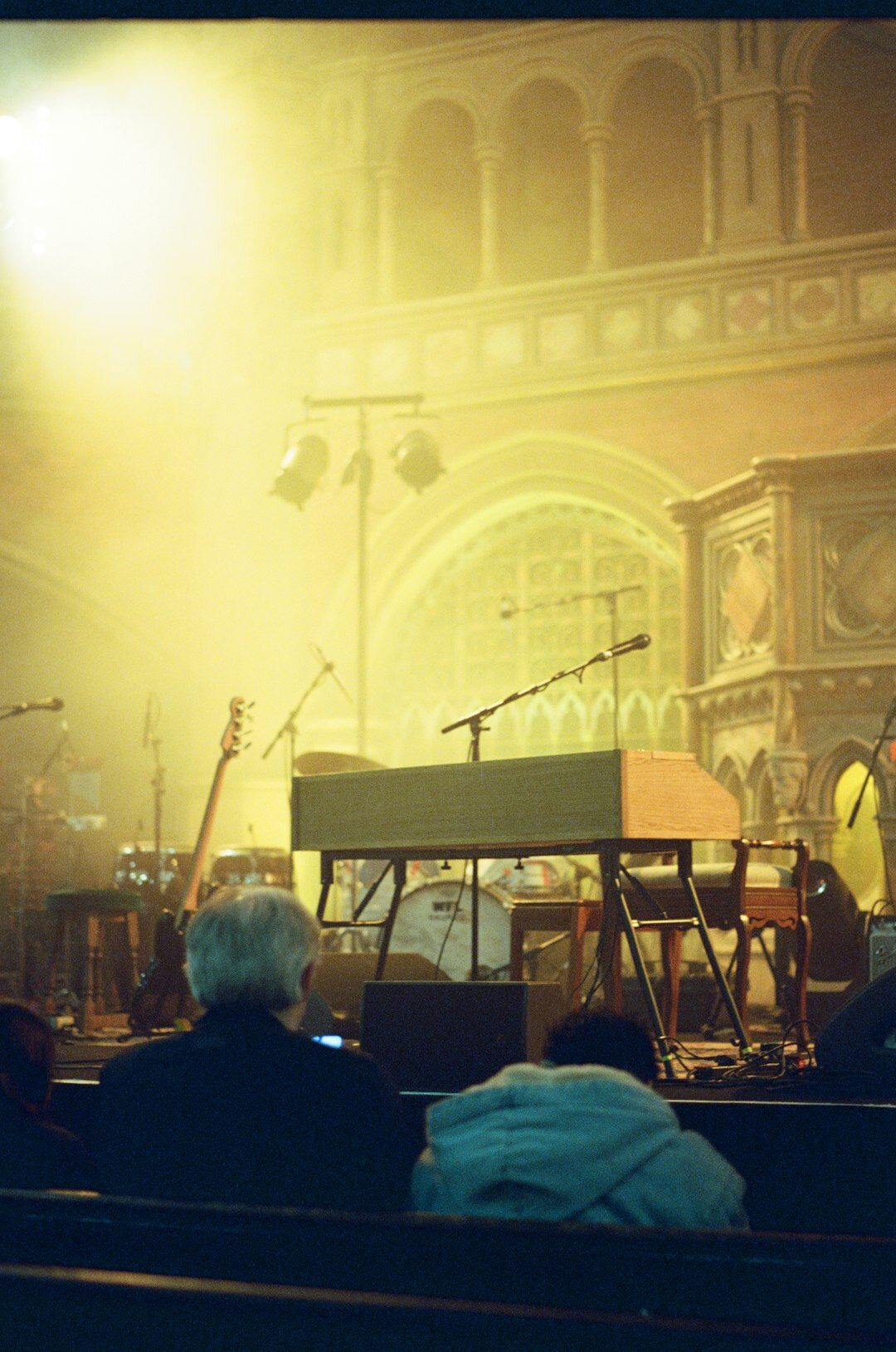 Grand piano in a softly lit concert hall