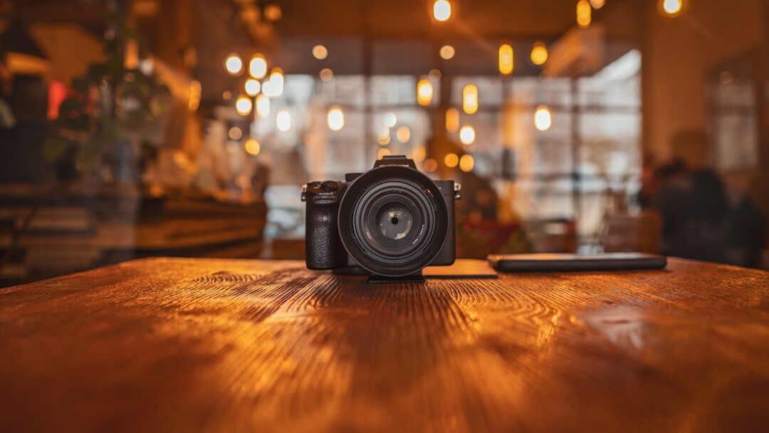 Vintage film camera and reel on a wooden table