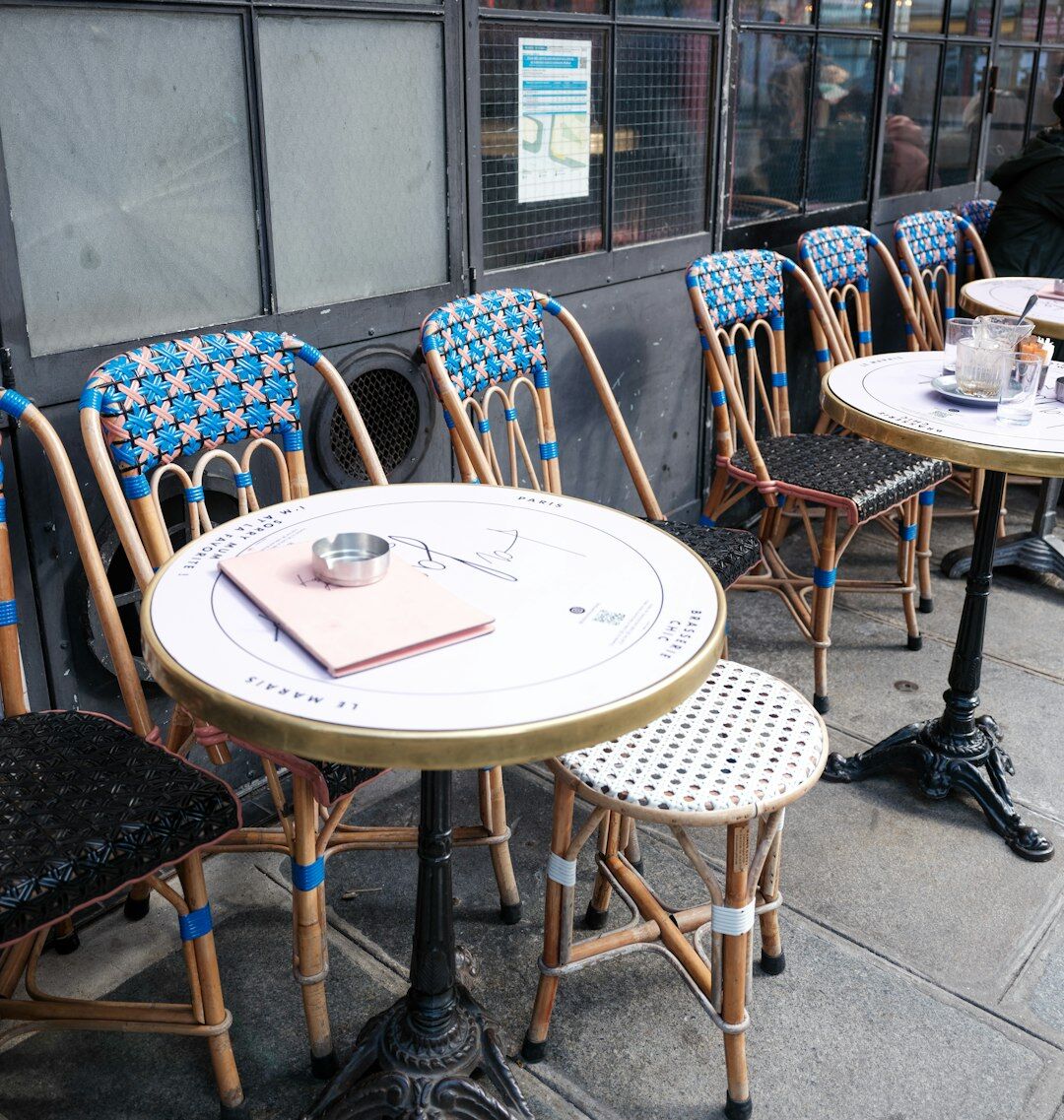 Minimalist café table with espresso cup and newspaper